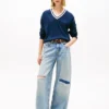 Tommy Jeans Pullover mit V-Ausschnitt und lockerer Passform Tommy Jeans Pullover mit V-Ausschnitt und lockerer Passform