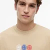 Tommy Jeans T-Shirt mit Multi-Crest-Logo Tommy Jeans T-Shirt mit Multi-Crest-Logo